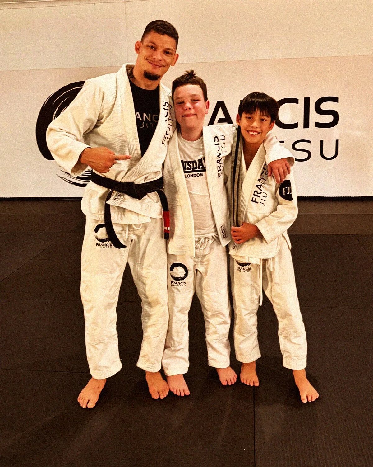 Coach Daan mentoring two FJJ students