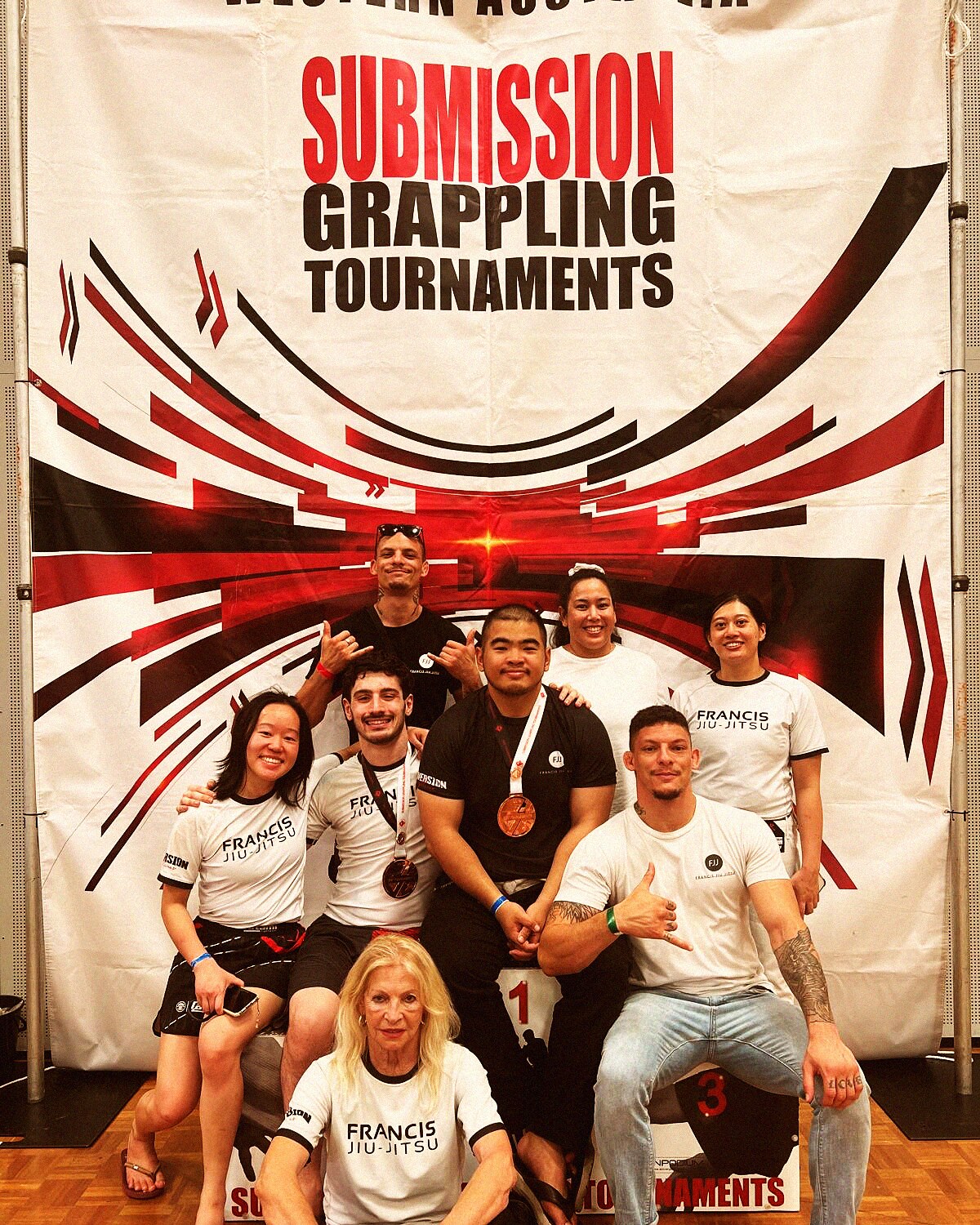 Full FJJ team at academy banner