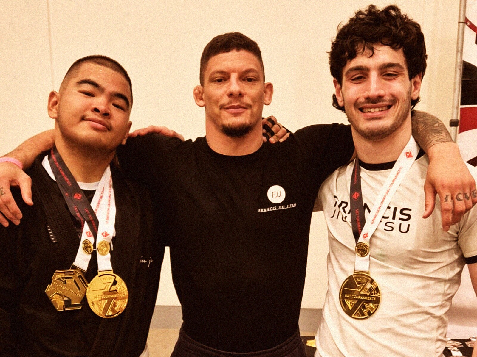 Coach Daan flanked by two FJJ medallists